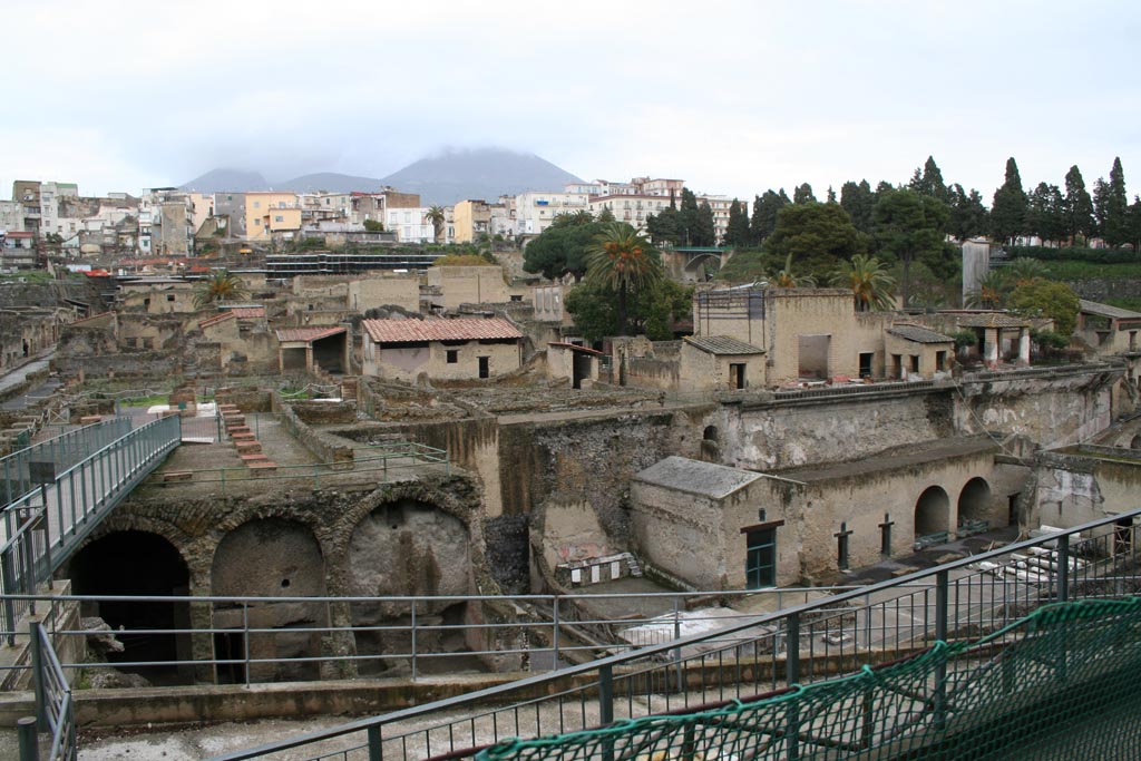 III.1/2/18/19, Herculaneum, March 2008. Looking north from access roadway towards upper and lower rooms, on right.
Note the access bridge leading onto the southern large terrace with remains of collapsed massive square pilasters.
Photo courtesy of Sera Baker.